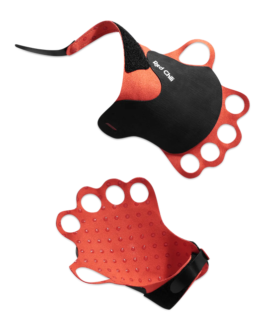 A pair of orange and black crack climbing gloves, showing the rubber exterior and microfiber interior 