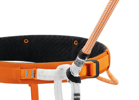 Petzl connect adjust, shown correctly attached to a climbing harness